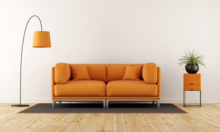 Modern living room with white wall orange couch and floor lamp - 3d rendering